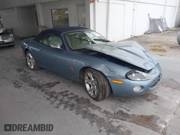 ✅ 2004 Jaguar XK • VIN: SAJDA42C442A37063 • Lot: 41382711. Listed on IAAI with 90,010 mi. Free auction sales archive from the USA and detailed vehicle history report at DreamBid. Image 1.