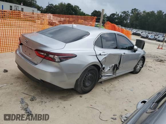 2021 Toyota Camry Hybrid LE with VIN 4T1C31AK7MU562031, listed as a Copart auction lot 71506375 with 82,877 mi miles and Salvage title. Bid and sale history available at DreamBid. Image 3.