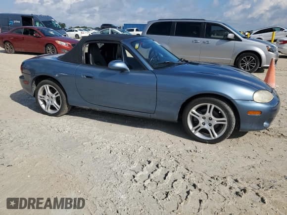 ✅ 2005 Mazda MX-5 Miata Cloth • VIN: JM1NB353250410343 • Лот: 73766474. Опубликован ранее на Copart с пробегом Не указан. Бесплатный доступ к архиву аукционных продаж из США и подробный отчёт об истории автомобиля на DreamBid. Изображение 4.