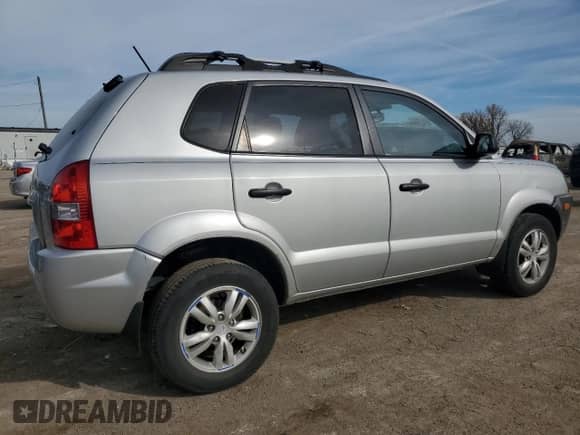 2009 Hyundai Tucson GLS with VIN KM8JM12B79U012399, listed as a Copart auction lot 77663414 with 164,615 mi miles and Salvage title. Bid and sale history available at DreamBid. Image 3.