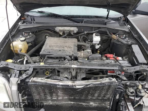 2009 Mercury Mariner z VIN 4M2CU81G39KJ17532, wystawiony jako Copart lot #43907455 z przebiegiem 214 212 mil mil oraz Szkoda całkowita • Salvage title. Historia ofert i sprzedaży dostępna na DreamBid. Obrazek 14.