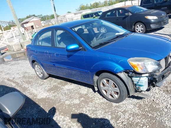 ✅ 2010 Kia Rio LX • VIN: KNADH4A39A6660317 • Lot: 43322093. Listed on IAAI with 70,003 mi. Free auction sales archive from the USA and detailed vehicle history report at DreamBid. Image 1.