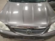 ✅ 2003 Mazda Tribute LX • VIN: 4F2YZ04173KM05549 • Lot: 86702895. Listed on Copart with 128,757 mi. Free auction sales archive from the USA and detailed vehicle history report at DreamBid. Image 12.