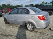 ✅ 2010 Kia Rio LX • VIN: KNADH4A36A6656371 • Lot: 64605635. Listed on Copart with 147,022 mi. Free auction sales archive from the USA and detailed vehicle history report at DreamBid. Image 2.