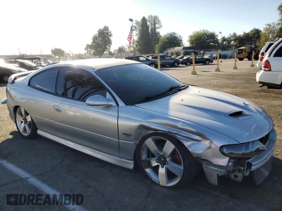✅ 2005 Pontiac GTO • VIN: 6G2VX12U25L463228 • Lot: 76843504. Listed on Copart with 153,047 mi. Free auction sales archive from the USA and detailed vehicle history report at DreamBid. Image 4.