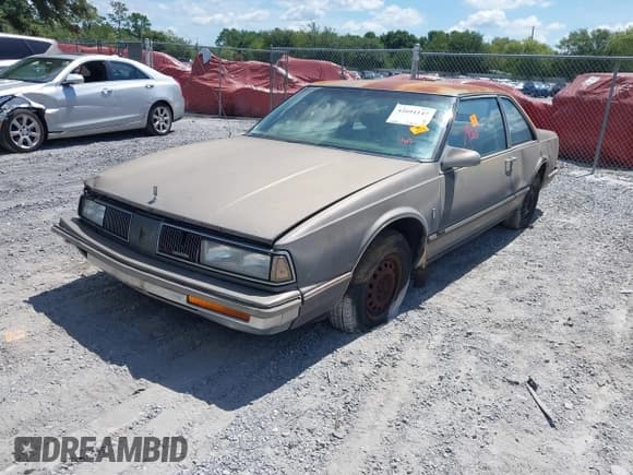 ✅ 1988 Oldsmobile Delta • VIN: 1G3HN14C7JW410839 • Lot: 42691147. Listed on IAAI with 124,911 mi. Free auction sales archive from the USA and detailed vehicle history report at DreamBid. Image 2.