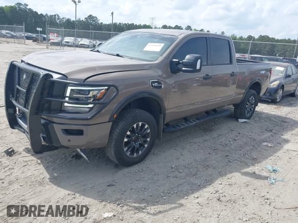 ✅ 2022 Nissan Titan Platinum Reserve • VIN: 1N6AA1FBXNN100016 • Лот: 42168548. Опубликован ранее на IAAI с пробегом 50 400 миль. Бесплатный доступ к архиву аукционных продаж из США и подробный отчёт об истории автомобиля на DreamBid. Изображение 17.