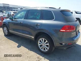 ✅ 2014 Volkswagen Touareg Sport • VIN: WVGEF9BPXED009920 • Лот: 43348238. Опубликован ранее на IAAI с пробегом 166 417 миль. Бесплатный доступ к архиву аукционных продаж из США и подробный отчёт об истории автомобиля на DreamBid. Изображение 3.