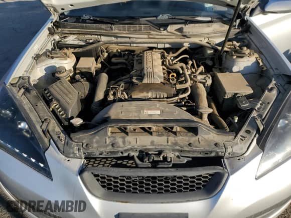 2010 Hyundai Genesis Coupe Premium z VIN KMHHT6KD0AU004424, wystawiony jako Copart lot #89006215 z przebiegiem 128 992 mil mil oraz Szkoda całkowita • Salvage title. Historia ofert i sprzedaży dostępna na DreamBid. Obrazek 11.