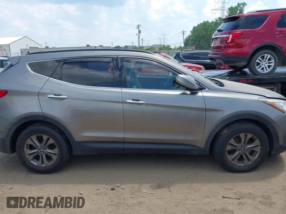 ✅ 2015 Hyundai Santa Fe • VIN: 5XYZUDLB5FG273437 • Лот: 42580624. Опубликован ранее на IAAI с пробегом 92 061 миль. Бесплатный доступ к архиву аукционных продаж из США и подробный отчёт об истории автомобиля на DreamBid. Изображение 13.