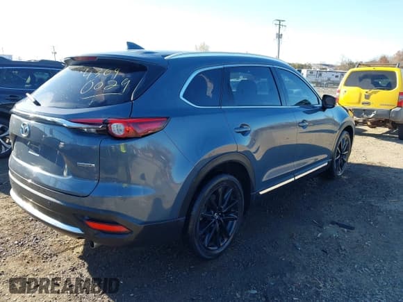 ✅ 2022 Mazda CX-9 Carbon Edition • VIN: JM3TCBDY1N0617356 • Lot: 43690029. Wystawiony na IAAI z przebiegiem 49 351 mil. Bezpłatny archiwum sprzedaży aukcyjnych z USA i szczegółowy raport historii pojazdu na DreamBid. Zdjęcie 4.
