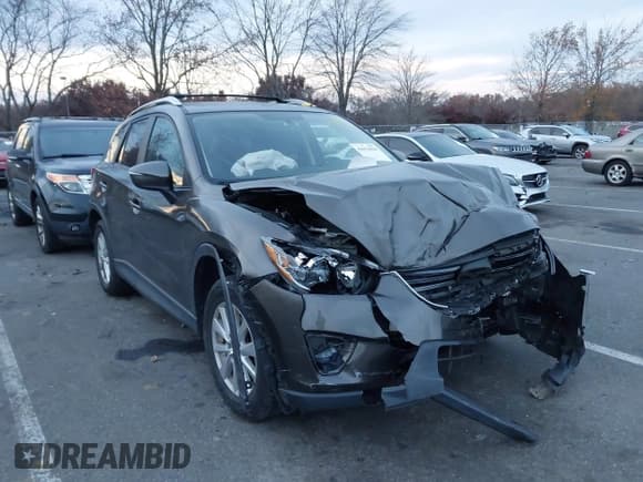 ✅ 2016 Mazda CX-5 Touring • VIN: JM3KE4CY5G0845575 • Lot: 43653030. Listed on IAAI with 79,795 mi. Free auction sales archive from the USA and detailed vehicle history report at DreamBid. Image 1.