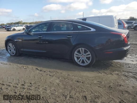 ✅ 2016 Jaguar XJ Portfolio • VIN: SAJWJ2GDXG8W03143 • Lot: 86467114. Listed on Copart with 42,923 mi. Free auction sales archive from the USA and detailed vehicle history report at DreamBid. Image 2.