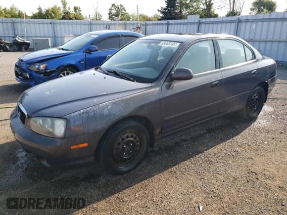 2003 Hyundai Elantra GLS z VIN KMHDN45DX3U590030, wystawiony jako Copart lot #69869194 z przebiegiem 161 175 mil mil oraz Czysty tytuł • Clean title. Historia ofert i sprzedaży dostępna na DreamBid. Obrazek 1.