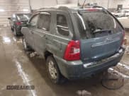 ✅ 2009 Kia Sportage LX • VIN: KNDJE723797611654 • Lot: 41581147. Wystawiony na IAAI z przebiegiem 161 415 mil. Bezpłatny archiwum sprzedaży aukcyjnych z USA i szczegółowy raport historii pojazdu na DreamBid. Zdjęcie 3.