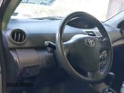 ✅ 2009 Toyota Yaris • VIN: JTDBT903691310529 • Lot: 43523187. Wystawiony na IAAI z przebiegiem 239 260 mil. Bezpłatny archiwum sprzedaży aukcyjnych z USA i szczegółowy raport historii pojazdu na DreamBid. Zdjęcie 7.