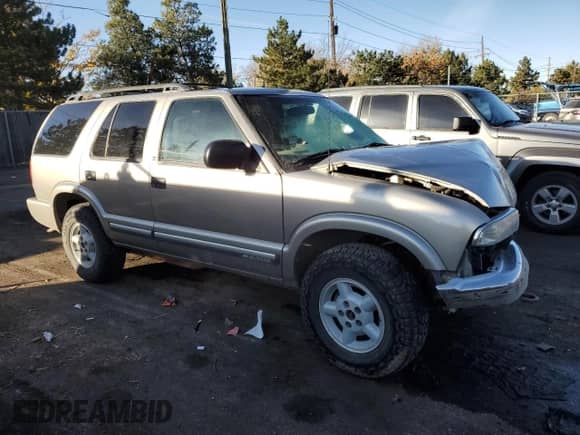 2000 Chevrolet Blazer LS z VIN 1GNDT13W7Y2221505, wystawiony jako Copart lot #78797974 z przebiegiem 149 678 mil mil oraz Nie do naprawy • Non repairable. Historia ofert i sprzedaży dostępna na DreamBid. Obrazek 4.