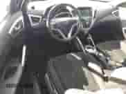 2017 Hyundai Veloster с VIN KMHTC6AD6HU316057, выставлен на аукционе Copart как лот 70424574 с пробегом 64 169 миль миль и Списание • Salvage title. История ставок и продаж доступна на DreamBid. Изображение 8.