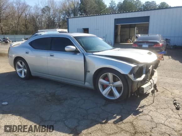 2009 Dodge Charger SRT-8 с VIN 2B3LA73W09H610039, выставлен на аукционе Copart как лот 86885314 с пробегом Не указан миль и Списание • Salvage title. История ставок и продаж доступна на DreamBid. Изображение 4.