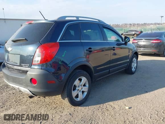 2015 Chevrolet Captiva Sport LS z VIN 3GNAL2EK5FS504411, wystawiony jako IAAI lot #41718728 z przebiegiem 72 474 mil mil oraz . Historia ofert i sprzedaży dostępna na DreamBid. Obrazek 4.