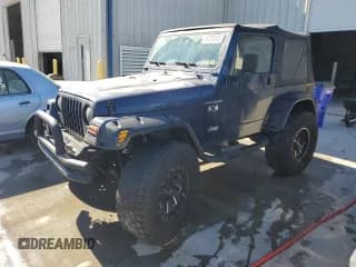 ✅ 2002 Jeep Wrangler X • VIN: 1J4FA39S52P740953 • Лот: 92245305. Опубликован ранее на Copart с пробегом 165 647 миль. Бесплатный доступ к архиву аукционных продаж из США и подробный отчёт об истории автомобиля на DreamBid. Изображение 1.