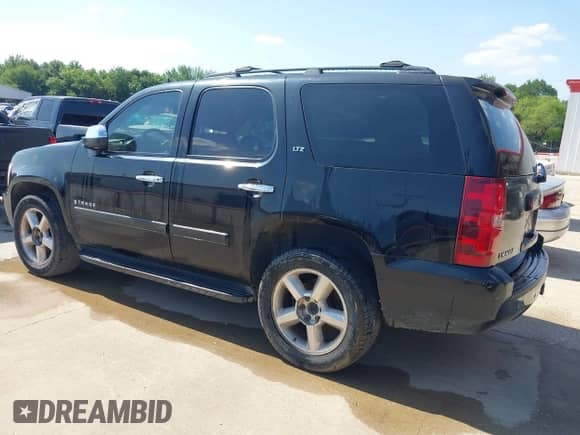 2008 Chevrolet Tahoe 2LT with VIN 1GNFC13098R136161, listed as a IAAI auction lot 42250146 with 328,795 mi miles and . Bid and sale history available at DreamBid. Image 3.