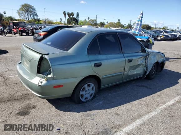 2004 Hyundai Accent GL z VIN KMHCG45C44U533952, wystawiony jako Copart lot #51181095 z przebiegiem 88 446 mil mil oraz Szkoda całkowita • Salvage title. Historia ofert i sprzedaży dostępna na DreamBid. Obrazek 3.