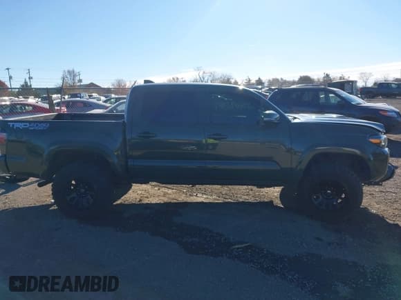 ✅ 2021 Toyota Tacoma SR • VIN: 3TMCZ5AN7MM440553 • Lot: 43609596. Listed on IAAI with 61,689 mi. Free auction sales archive from the USA and detailed vehicle history report at DreamBid. Image 14.