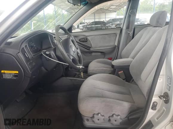 2004 Hyundai Elantra GLS with VIN KMHDN46D14U773672, listed as a Copart auction lot 69194635 with 189,128 mi miles and Salvage title. Bid and sale history available at DreamBid. Image 7.