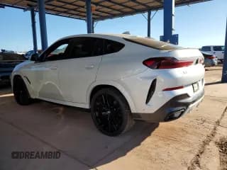 ✅ 2023 BMW X6 xDrive40i • VIN: 5UXCY6C07P9R94803 • Лот: 82569115. Опубликован ранее на Copart с пробегом 28 206 миль. Бесплатный доступ к архиву аукционных продаж из США и подробный отчёт об истории автомобиля на DreamBid. Изображение 2.