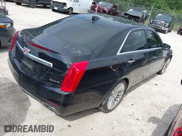 ✅ 2015 Cadillac CTS Luxury AWD • VIN: 1G6AX5SX5F0109217 • Lot: 42983192. Listed on IAAI with 54,841 mi. Free auction sales archive from the USA and detailed vehicle history report at DreamBid. Image 4.