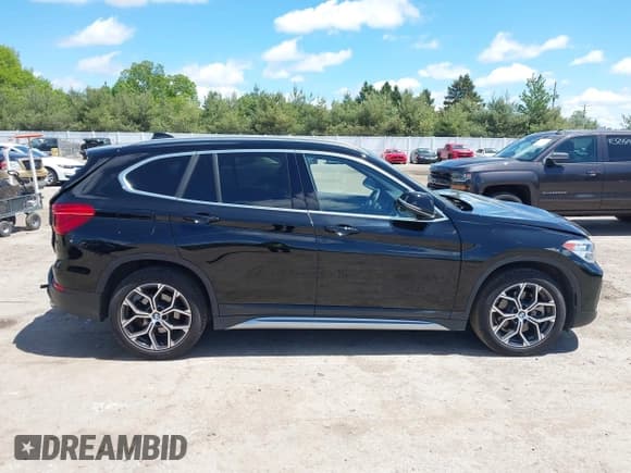 ✅ 2022 BMW X1 xDrive28i • VIN: WBXJG9C00N5U64709 • Lot: 42319210. Listed on IAAI with 37,062 mi. Free auction sales archive from the USA and detailed vehicle history report at DreamBid. Image 14.