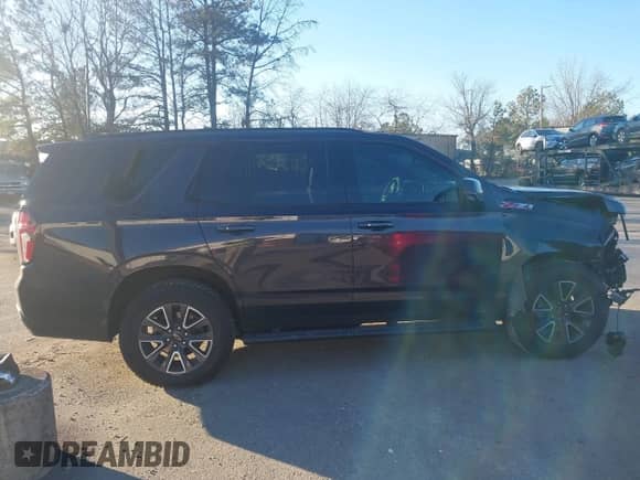 2022 Chevrolet Tahoe Z71 z VIN 1GNSKPKD3NR277652, wystawiony jako IAAI lot #41335976 z przebiegiem 42 982 mil mil oraz . Historia ofert i sprzedaży dostępna na DreamBid. Obrazek 13.