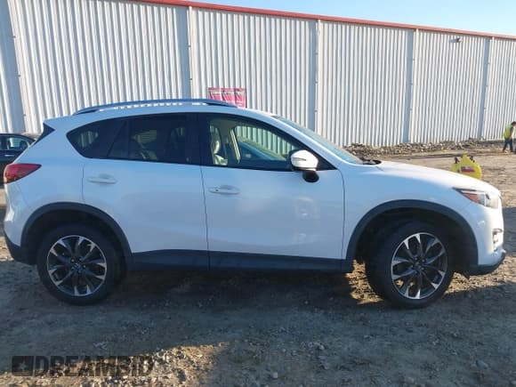 ✅ 2016 Mazda CX-5 Grand Touring • VIN: JM3KE2DYXG0796487 • Lot: 43624306. Wystawiony na IAAI z przebiegiem 233 746 mil. Bezpłatny archiwum sprzedaży aukcyjnych z USA i szczegółowy raport historii pojazdu na DreamBid. Zdjęcie 13.