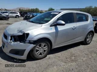 2013 Chevrolet Sonic LT with VIN 1G1JC6SBXD4247028, listed as a Copart auction lot 66031115 with 134,548 mi miles and Salvage title. Bid and sale history available at DreamBid. Image 1.