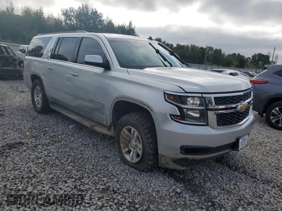 2015 Chevrolet Suburban LT with VIN 1GNSKJKC9FR147607, listed as a Copart auction lot 82344395 with 164,883 mi miles and Salvage title. Bid and sale history available at DreamBid. Image 4.