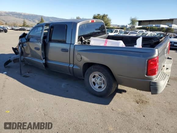 2006 Dodge Dakota ST z VIN 1D7HE28K26S626657, wystawiony jako Copart lot #88314565 z przebiegiem 186 690 mil mil oraz Szkoda całkowita • Salvage title. Historia ofert i sprzedaży dostępna na DreamBid. Obrazek 2.