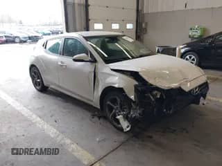 2019 Hyundai Veloster Premium z VIN KMHTG6AF7KU019571, wystawiony jako IAAI lot #41478431 z przebiegiem 107 197 mil mil oraz . Historia ofert i sprzedaży dostępna na DreamBid. Obrazek 1.