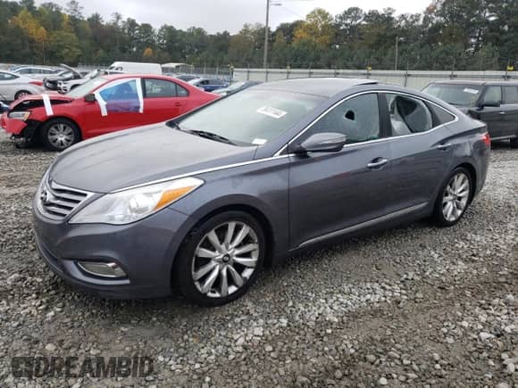 2013 Hyundai Azera z VIN KMHFH4JG2DA255430, wystawiony jako Copart lot #79411144 z przebiegiem 207 750 mil mil oraz Szkoda całkowita • Salvage title. Historia ofert i sprzedaży dostępna na DreamBid. Obrazek 1.