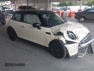 ✅ 2023 MINI Hardtop Cooper • VIN: WMW33DH06P2T73104 • Lot: 42651262. Listed on IAAI with 45,837 mi. Free auction sales archive from the USA and detailed vehicle history report at DreamBid. Image 1.
