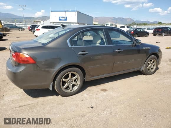 ✅ 2009 Kia Optima LX • VIN: KNAGE228495282591 • Лот: 70416644. Опубликован ранее на Copart с пробегом 119 360 миль. Бесплатный доступ к архиву аукционных продаж из США и подробный отчёт об истории автомобиля на DreamBid. Изображение 3.