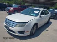 ✅ 2010 Ford Fusion Hybrid • VIN: 3FADP0L3XAR185989 • Lot: 43156692. Listed on IAAI with 226,637 mi. Free auction sales archive from the USA and detailed vehicle history report at DreamBid. Image 2.