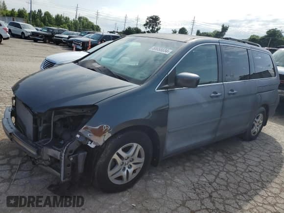 ✅ 2005 Honda Odyssey EX • VIN: 5FNRL38405B409311 • Lot: 55658634. Listed on Copart with 189,322 mi. Free auction sales archive from the USA and detailed vehicle history report at DreamBid. Image 1.