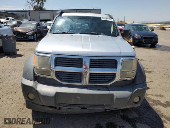 2007 Dodge Nitro SXT z VIN 1D8GU28K97W636431, wystawiony jako Copart lot #66031104 z przebiegiem 184 002 mil mil oraz Szkoda całkowita • Salvage title. Historia ofert i sprzedaży dostępna na DreamBid. Obrazek 5.