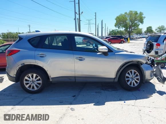 ✅ 2015 Mazda CX-5 Sport • VIN: JM3KE2BEXF0527431 • Lot: 41832024. Listed on IAAI with 131,215 mi. Free auction sales archive from the USA and detailed vehicle history report at DreamBid. Image 13.