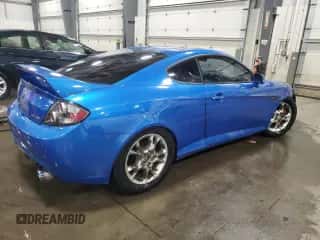 2007 Hyundai Tiburon GT z VIN KMHHN66F07U254955, wystawiony jako Copart lot #82239034 z przebiegiem 193 900 mil mil oraz Szkoda całkowita • Salvage title. Historia ofert i sprzedaży dostępna na DreamBid. Obrazek 3.