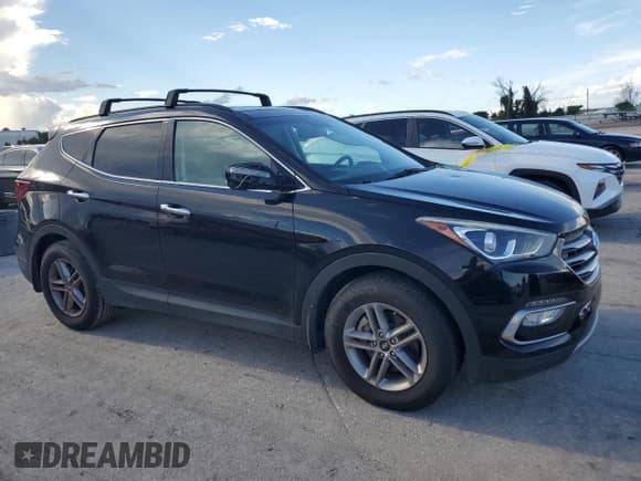 ✅ 2018 Hyundai Santa Fe 2.4L • VIN: 5NMZU3LB7JH078352 • Лот: 69099604. Опубликован ранее на Copart с пробегом 76 030 миль. Бесплатный доступ к архиву аукционных продаж из США и подробный отчёт об истории автомобиля на DreamBid. Изображение 4.