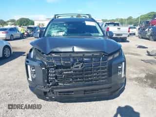 2025 Hyundai Palisade XRT z VIN KM8R34GE0SU945657, wystawiony jako IAAI lot #43298136 z przebiegiem 1 334 mil mil oraz . Historia ofert i sprzedaży dostępna na DreamBid. Obrazek 6.