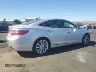 ✅ 2013 Hyundai Azera • VIN: KMHFH4JG9DA312271 • Лот: 67407885. Опубликован ранее на Copart с пробегом 106 193 миль. Бесплатный доступ к архиву аукционных продаж из США и подробный отчёт об истории автомобиля на DreamBid. Изображение 3.