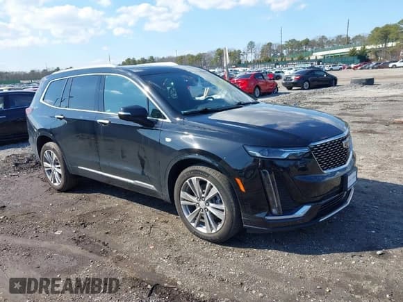 ✅ 2023 Cadillac XT6 AWD Premium Luxury • VIN: 1GYKPDRS8PZ153838 • Лот: 41838527. Опубликован ранее на IAAI с пробегом 60 034 миль. Бесплатный доступ к архиву аукционных продаж из США и подробный отчёт об истории автомобиля на DreamBid. Изображение 1.